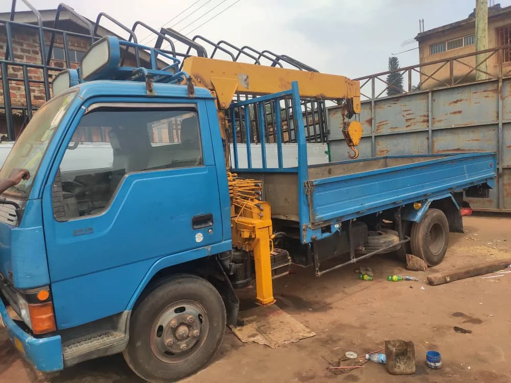 Crane truck and generator equipment on site in Uganda