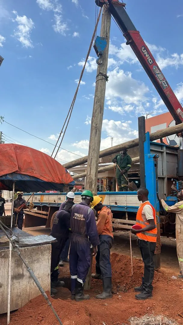 Utility pole relocation and crane operations on the Luweero-Nakaseke road upgrading project