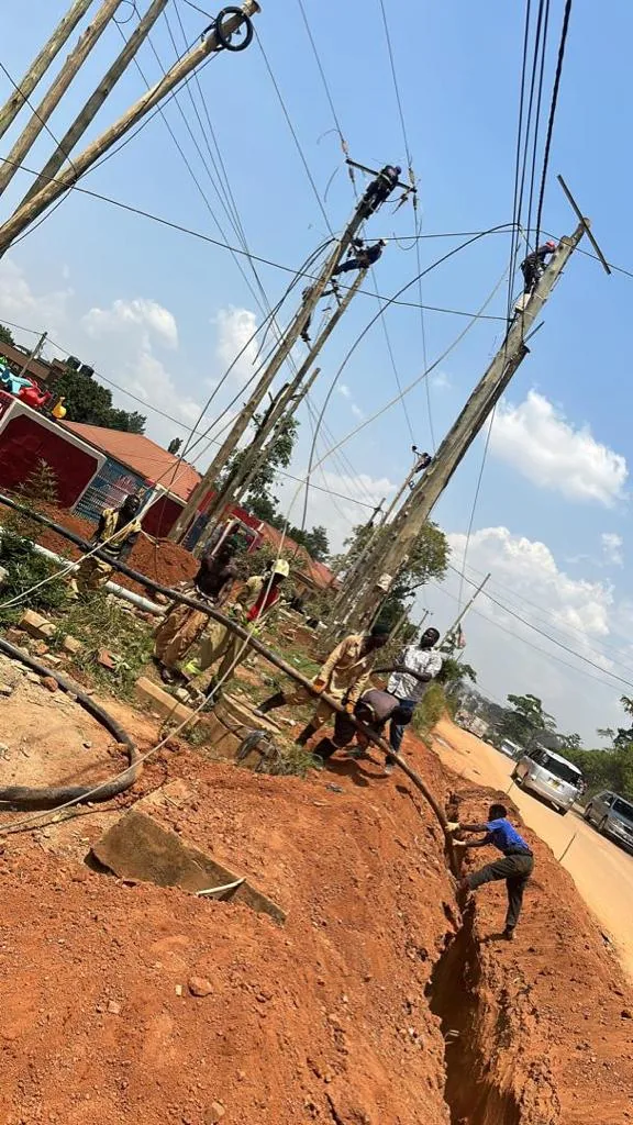 PKAAS electrical engineering crew erecting medium-voltage power line poles